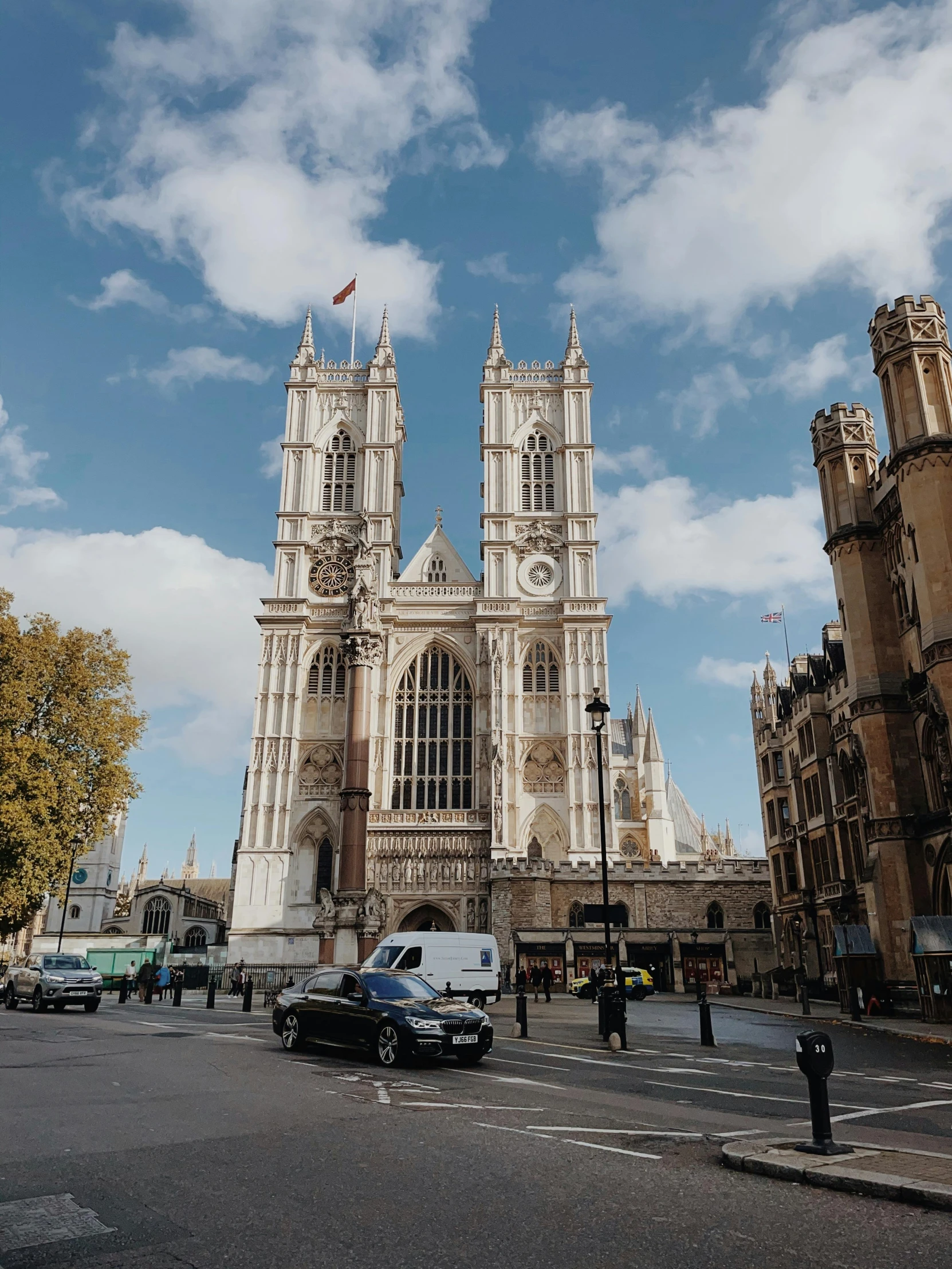 a group of cars driving down a street next to tall buildings, baroque, alabaster gothic cathedral, 🚿🗝📝, underwater westminster, thumbnail