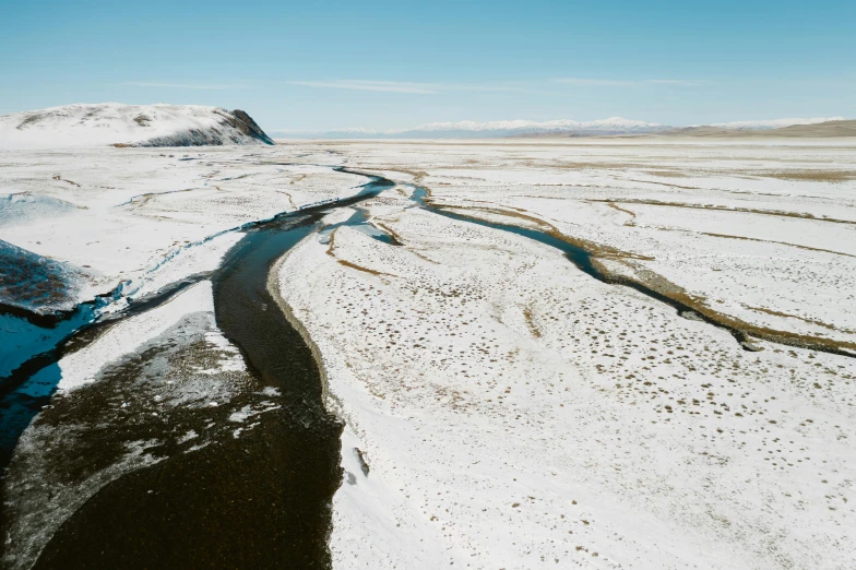 a river running through a snow covered field, unsplash contest winner, hurufiyya, naranbaatar ganbold, shot on hasselblad, geology, slide show