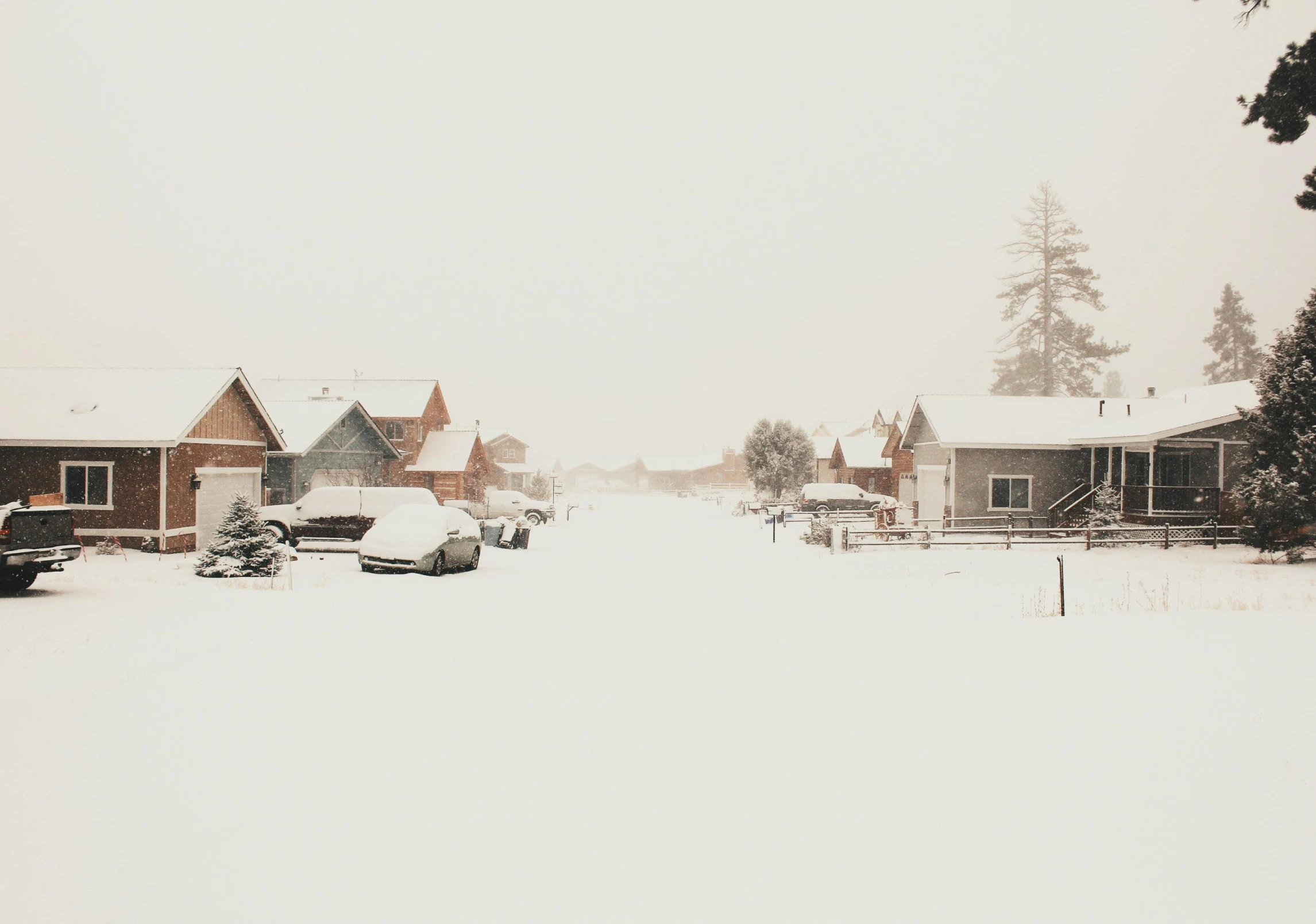 a couple of cars that are parked in the snow, by Carey Morris, pexels contest winner, hyperrealism, tiny village, dusty street, photography of todd hido, (3 are winter