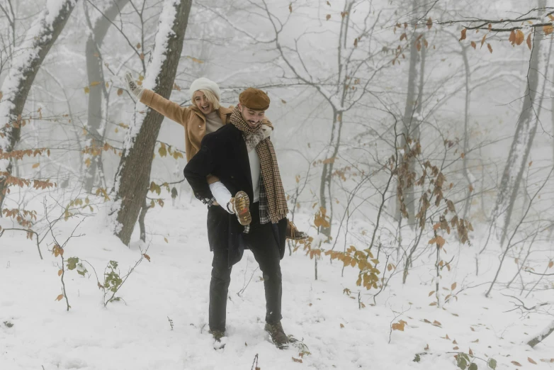 a man carrying a woman on his back in the snow, pexels contest winner, snowing in the forest, thumbnail, cinematic outfit photo, movie still 8 k