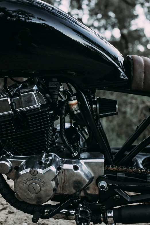 a motorcycle parked on the side of a dirt road, by Daniel Seghers, unsplash, conceptual art, upper body close up, pipes, black, high detail photograph