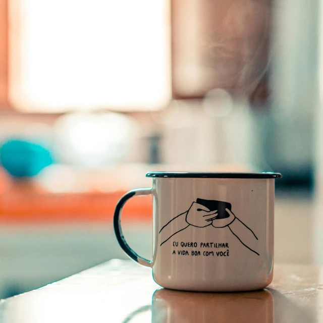 a close up of a coffee cup on a table, a picture, saying, warm space, thumbnail, pot