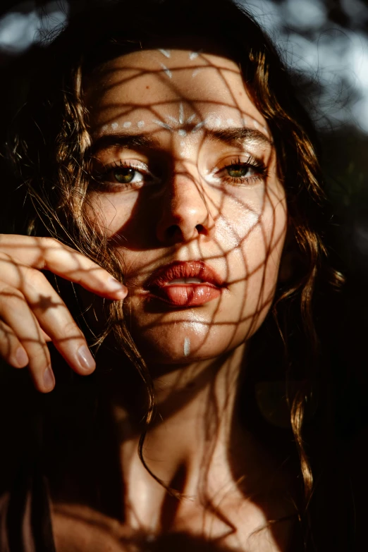 a woman with her hair blowing in the wind, by Adam Marczyński, trending on pexels, photorealism, fishnet, full lips, sun light, portrait 8 k