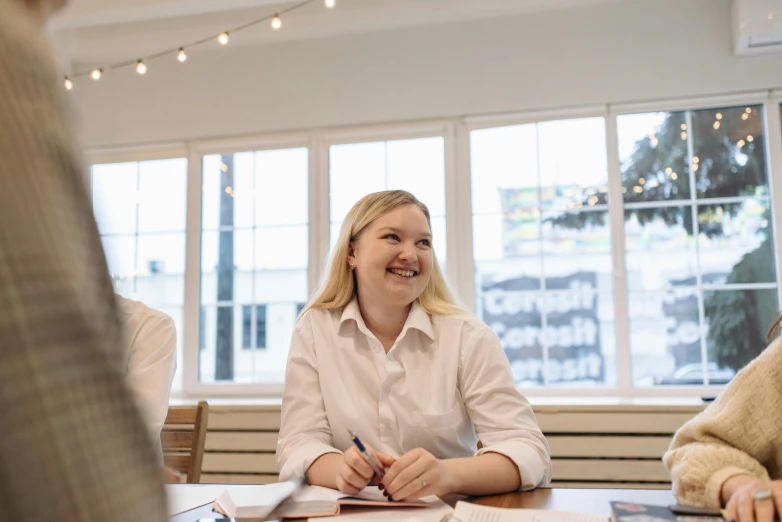 a group of people sitting around a table, on a white table, profile image, reykjavik junior college, background image