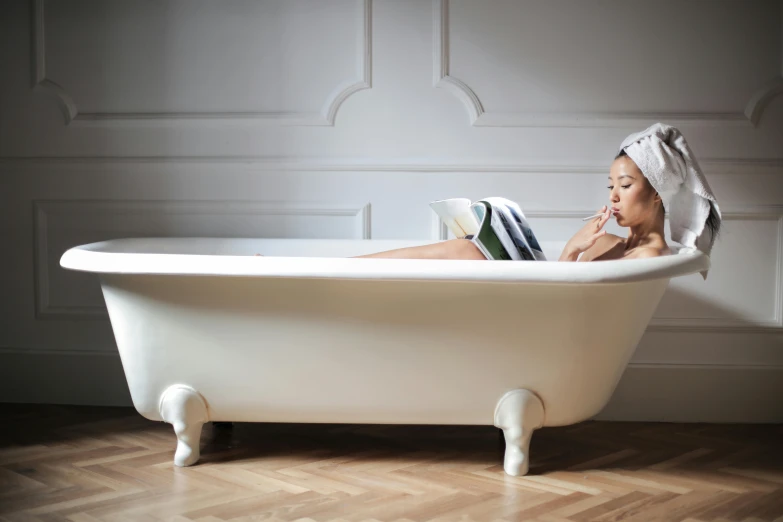 a woman sitting in a bathtub with a towel on her head, inspired by Sarah Lucas, unsplash, titanic tank with legs, trending on dezeen, little kid, delightful surroundings