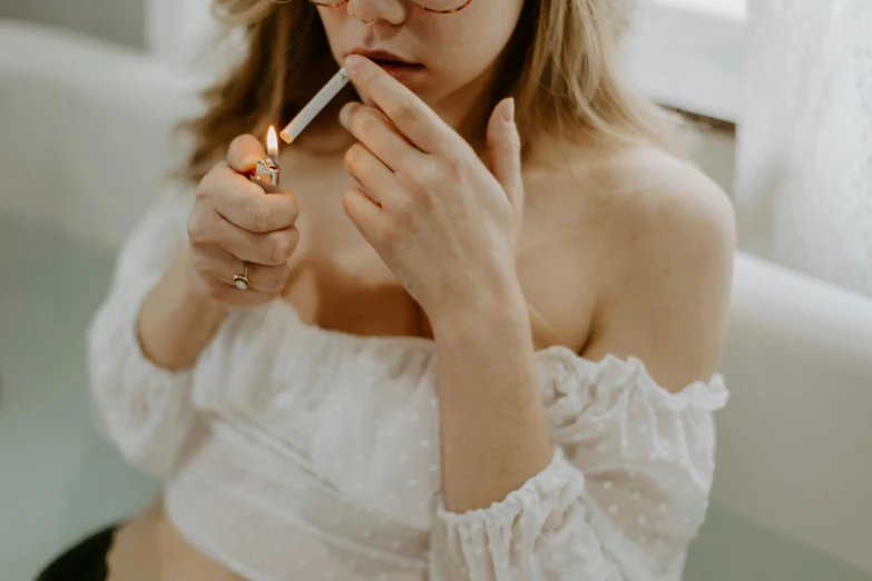 a woman in a white top smokes a cigarette, inspired by Elsa Bleda, trending on pexels, white candles, girl with glasses, woman holding another woman, half body photo