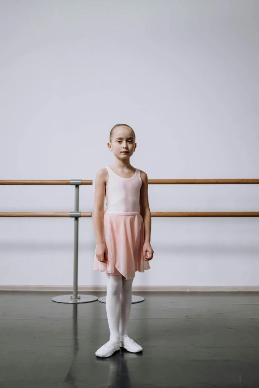 a little girl standing in a dance studio, a picture, by Grace Polit, pexels contest winner, greta thunberg, ready to model, no legs, photographed for reuters