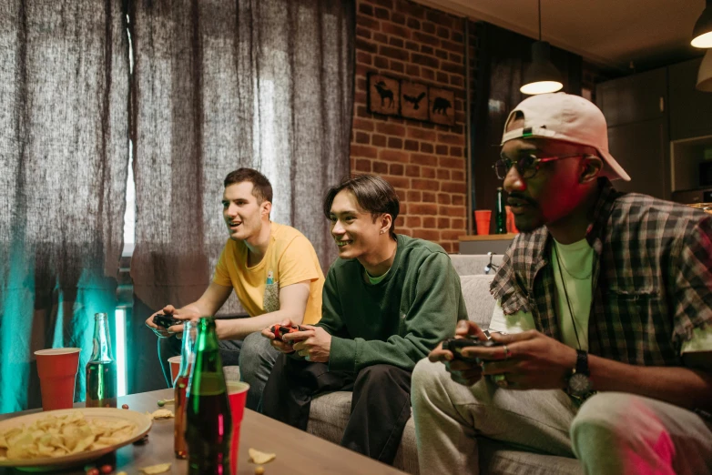 three men sitting on a couch playing a video game, pexels, avatar image, college party, snes game, instagram photo