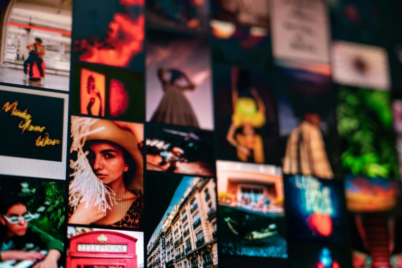 a bunch of pictures hanging on a wall, by Daniel Lieske, trending on pexels, red and cinematic lighting, colourful close up shot, travel photography, squares