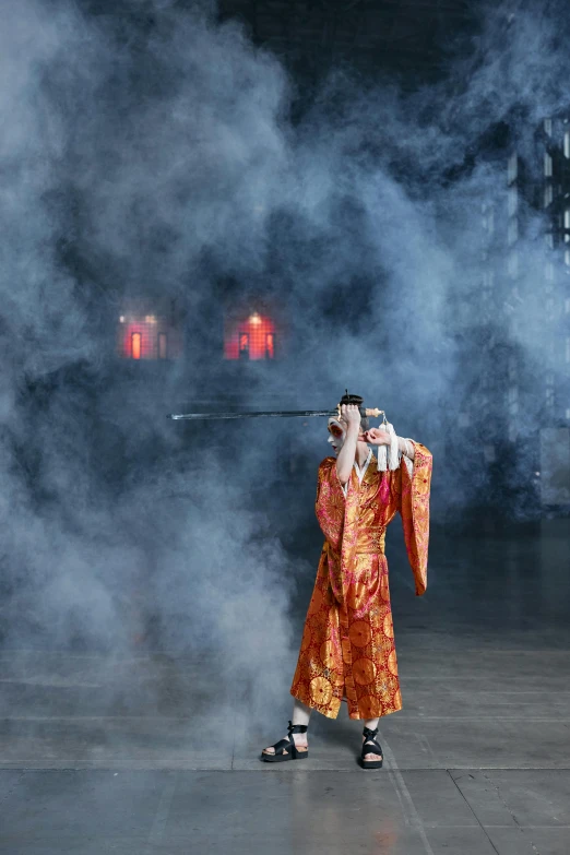 a person that is standing in the smoke, pexels contest winner, ukiyo-e, on the runway, brocade robes, still shot from movie, wearing tumultus flames