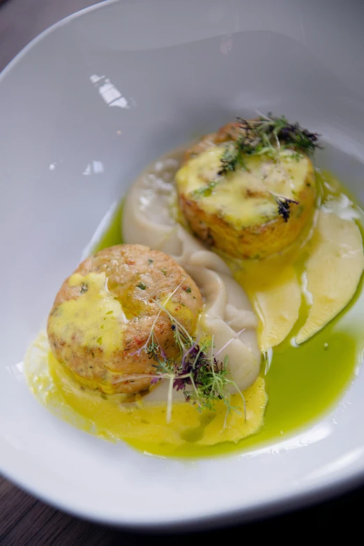 a close up of a plate of food on a table, bulbous, brimstone, cheesy, servando lupini