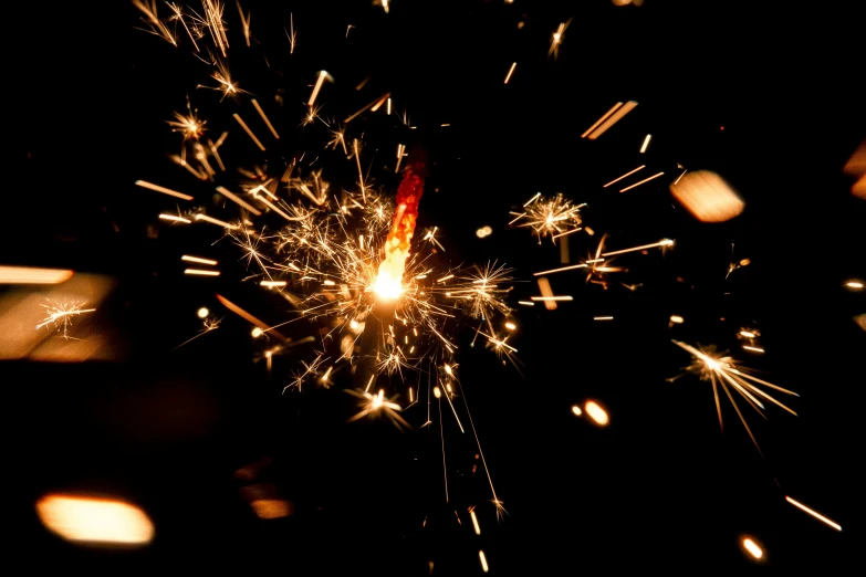 a close up of a sparkler in the dark, pexels, hurufiyya, getty images, thumbnail, confetti, ilustration