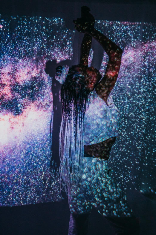 a woman standing in front of a projection screen, unsplash contest winner, conceptual art, glitter dress, floating!!! in a nebula, floating long hair, grainy photo