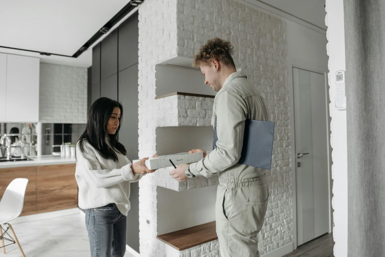 a couple of people that are standing in a room, letterbox, architectural planning, thumbnail, high-quality photo