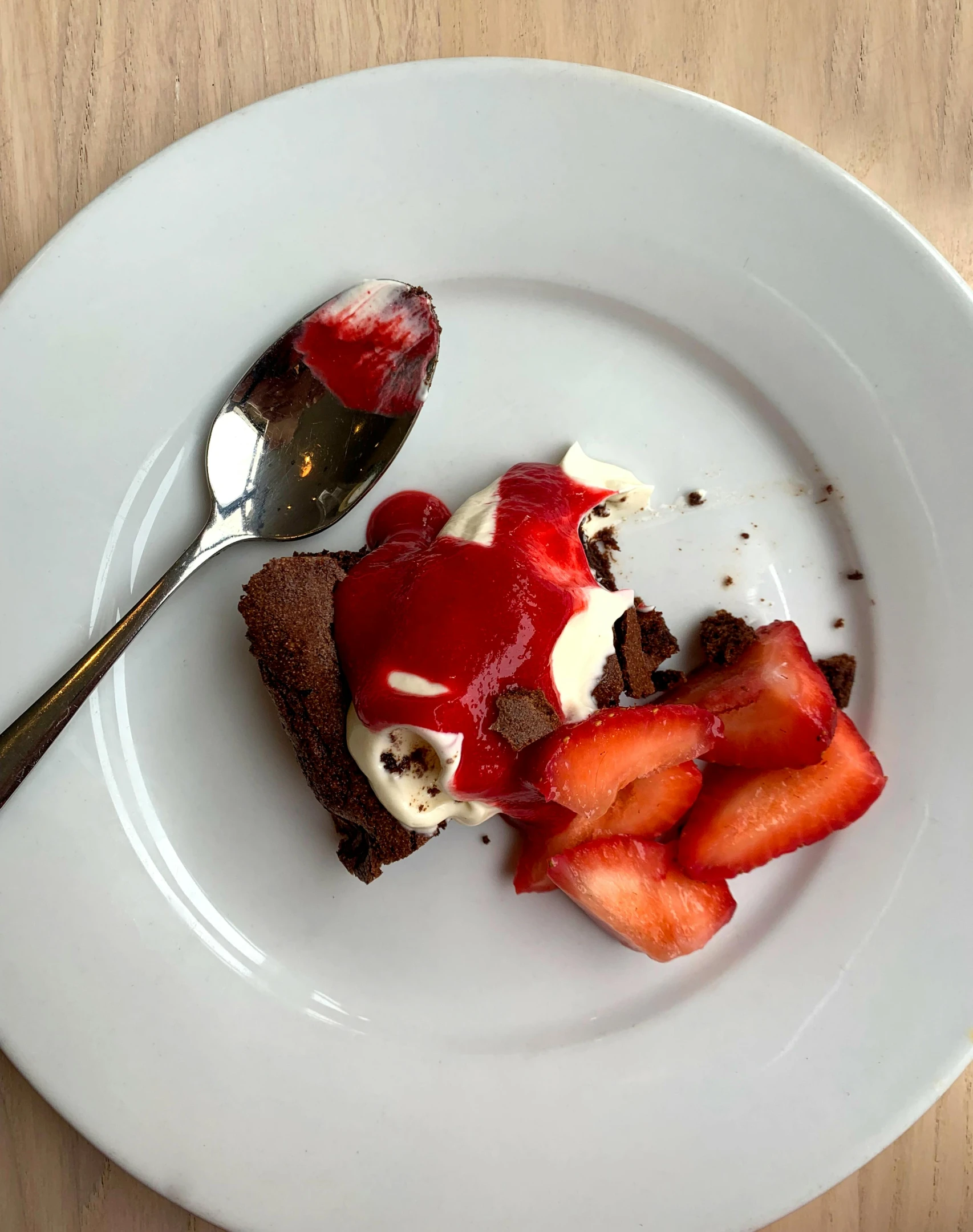 a white plate topped with a piece of cake and strawberries, by Anna Haifisch, taken on iphone 1 3 pro, chocolate, “ iron bark, gif