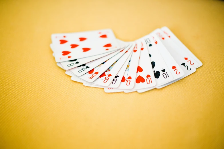 a bunch of playing cards sitting on top of a table, pexels contest winner, plasticien, yellow and red, folded, square, soft