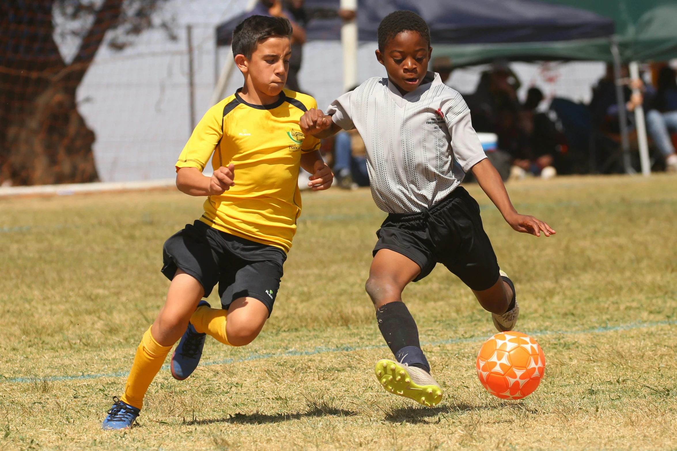 a couple of kids playing a game of soccer, a picture, by Lisa Milroy, pexels contest winner, ashcan school, sprinters in a race, closeup, 15081959 21121991 01012000 4k, full lenght shot