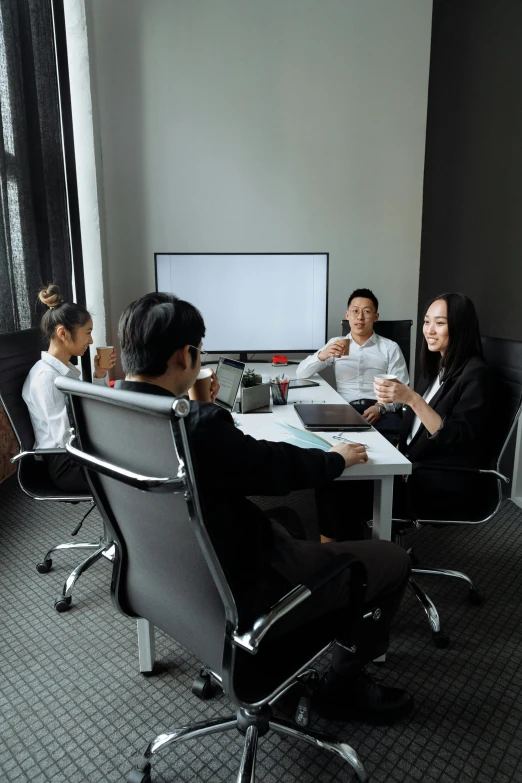 a group of people sitting around a table, in an office, david luong, profile image, hangzhou