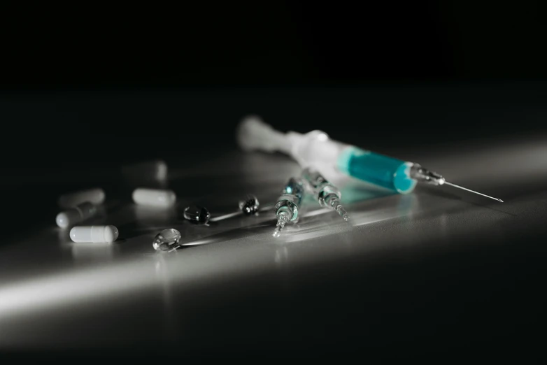 a close up of a syll on a table, a digital rendering, pexels, syringes, floating crystals, steroid use, intravenous drip