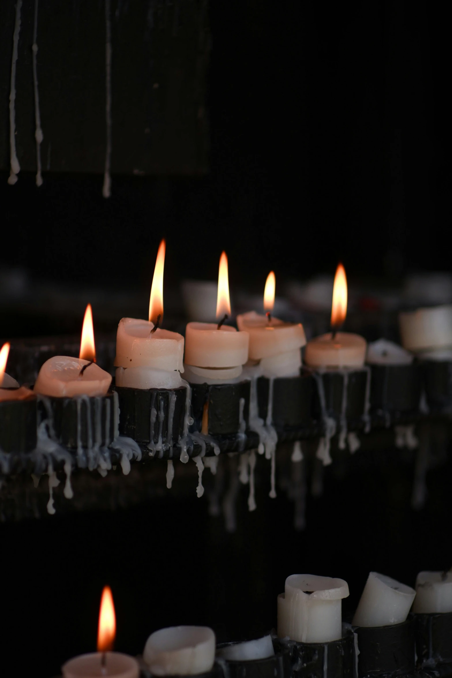 a group of lit candles sitting on top of a table, deteriorated, slate, instagram photo, ignant