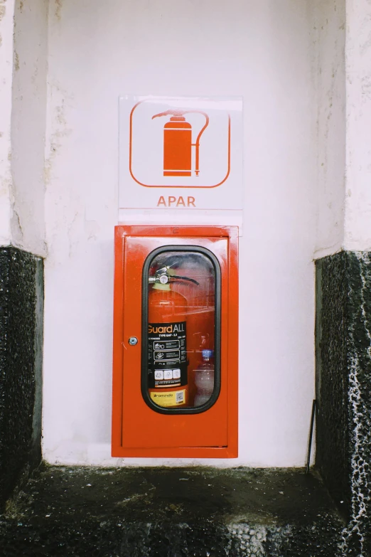 a fire hydrant that is on the side of a building, jar on a shelf, 2019 trending photo, orange safety labels, pararel