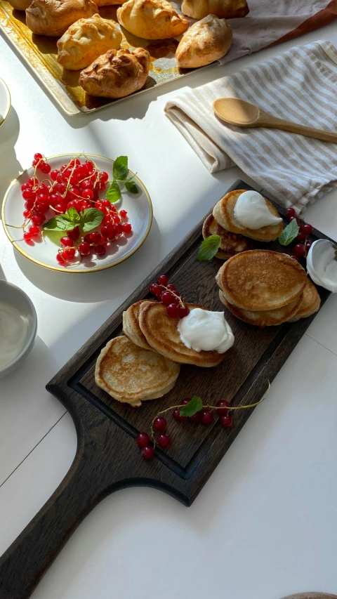 a table topped with plates of food and utensils, living food adorable pancake, hammershøi, product image, small