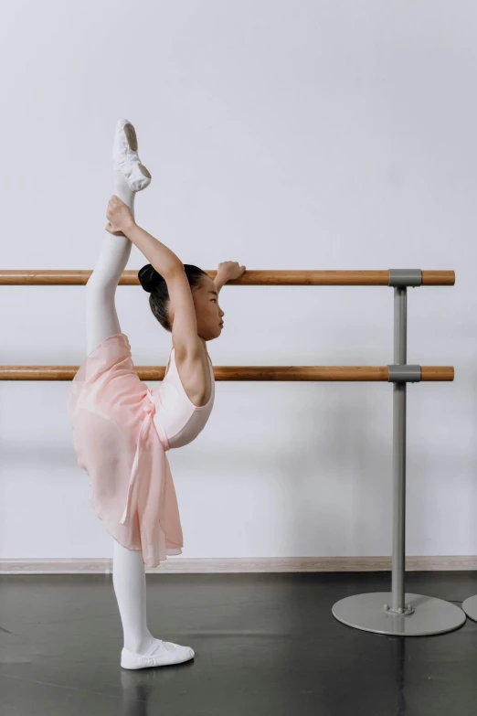 a woman in a pink dress doing a ballet pose, pexels contest winner, arabesque, panoramic view of girl, white, square, no - text no - logo