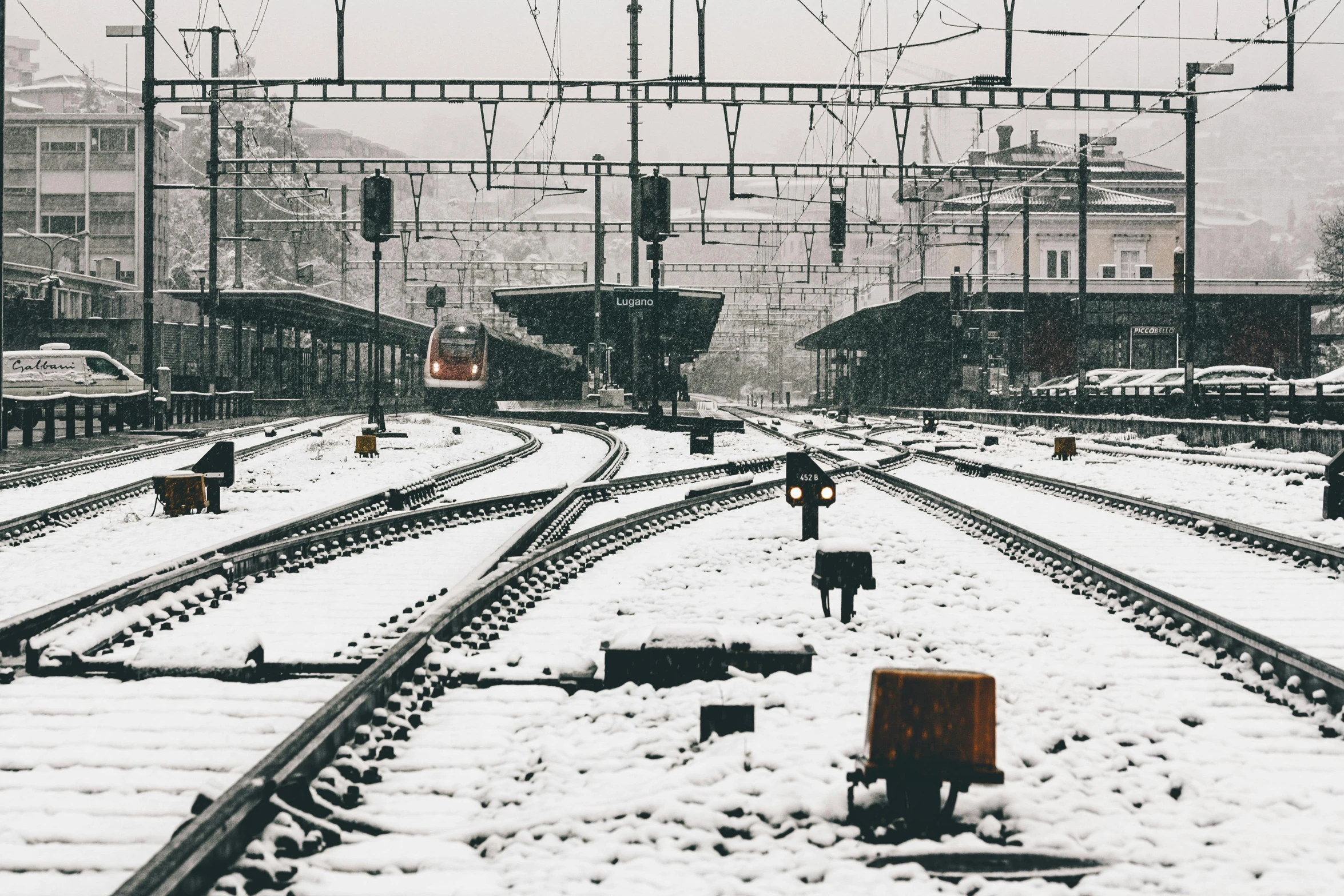 a train station filled with lots of tracks covered in snow, pexels contest winner, 💋 💄 👠 👗, sad atmosphere, festivals, 90's photo