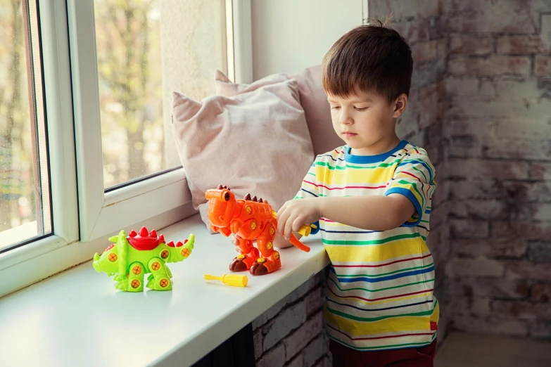 a young boy playing with toys on a window sill, inspired by Károly Brocky, dinosaurs, wearing spiky, quick assembly, soft draconic features