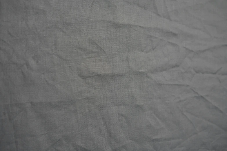 a black and white photo of a sheet of paper, by Agnes Martin, deviantart, figuration libre, cotton fabric, flat grey color, taupe, tight wrinkled cloath