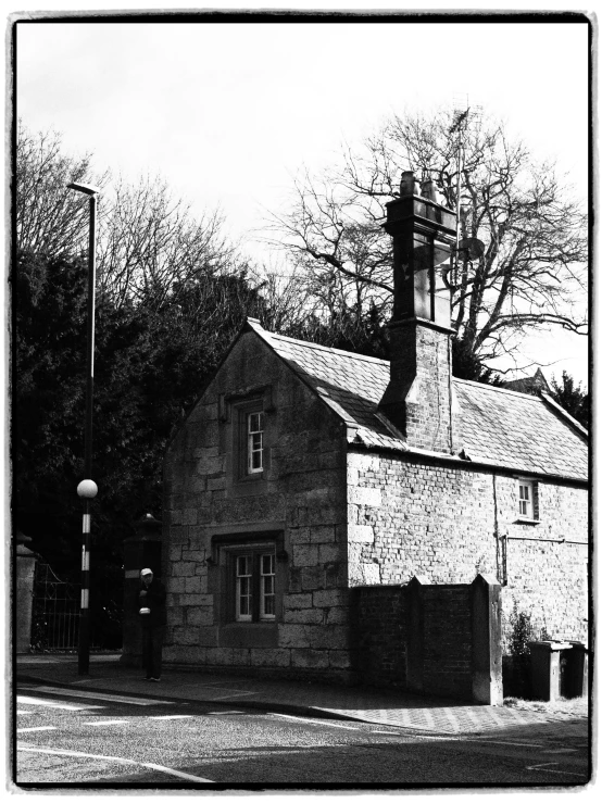 a black and white photo of a house, by Neil Williams, street scene with water tower, dean cornwall, deep colour\'s, robert maplethorpe