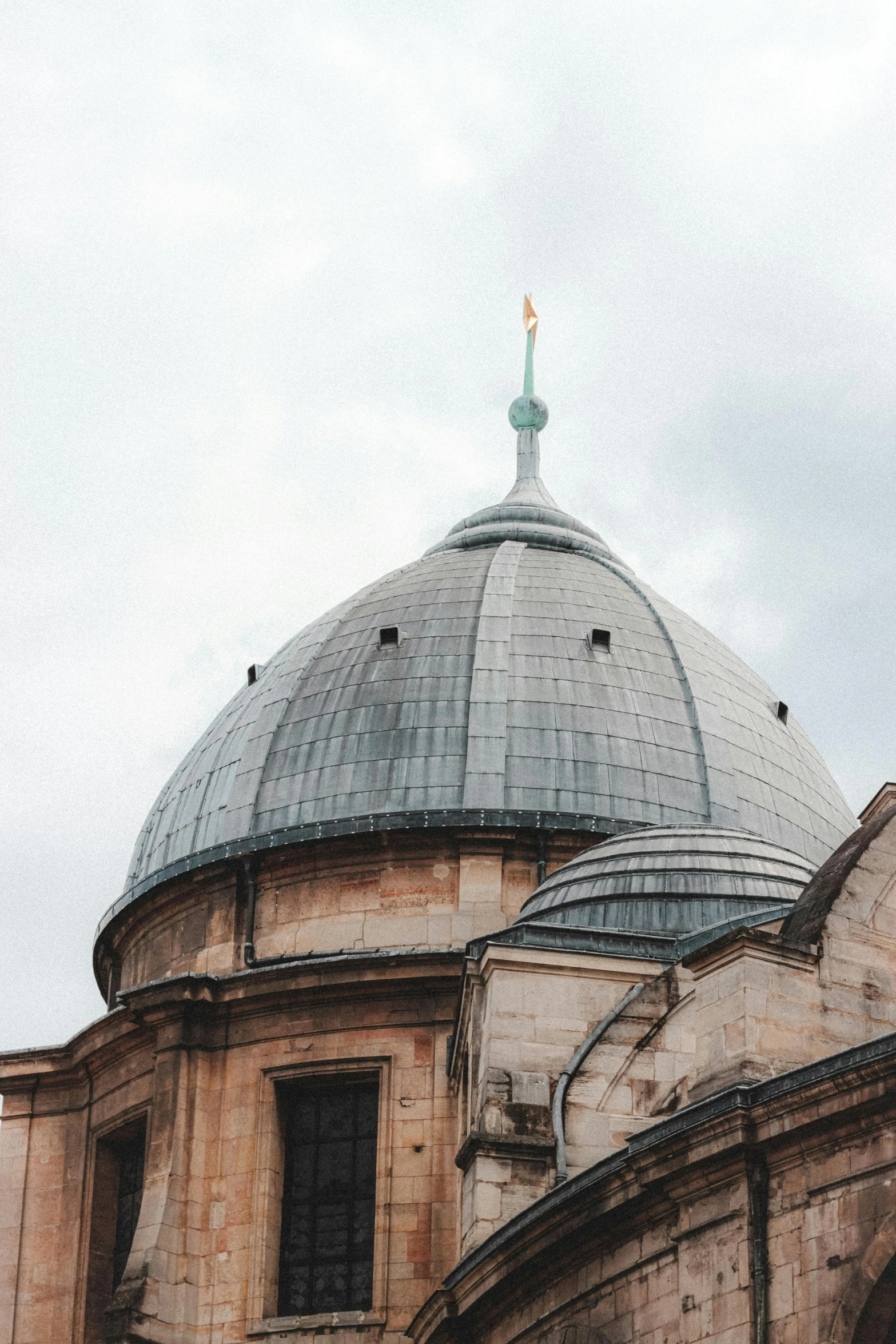 a large building with a dome on top of it, inspired by Modest Urgell, trending on unsplash, turkey, topknot, grainy, religious