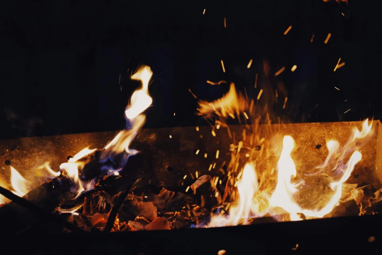 a close up of a fire with flames coming out of it, pexels contest winner, warm summer nights, analogue photo, metalwork, ilustration