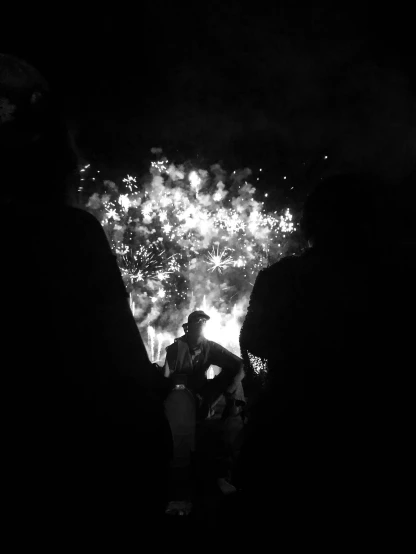 a black and white photo of people watching fireworks, a black and white photo, by Anato Finnstark, ilustration, fire and explosion, black & white photo, cinematic!!