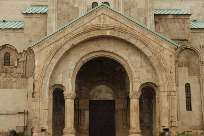 a large building with a clock on top of it, an album cover, inspired by Károly Markó the Elder, pexels contest winner, romanesque, symmetrical doorway, assyrian, churches, brown