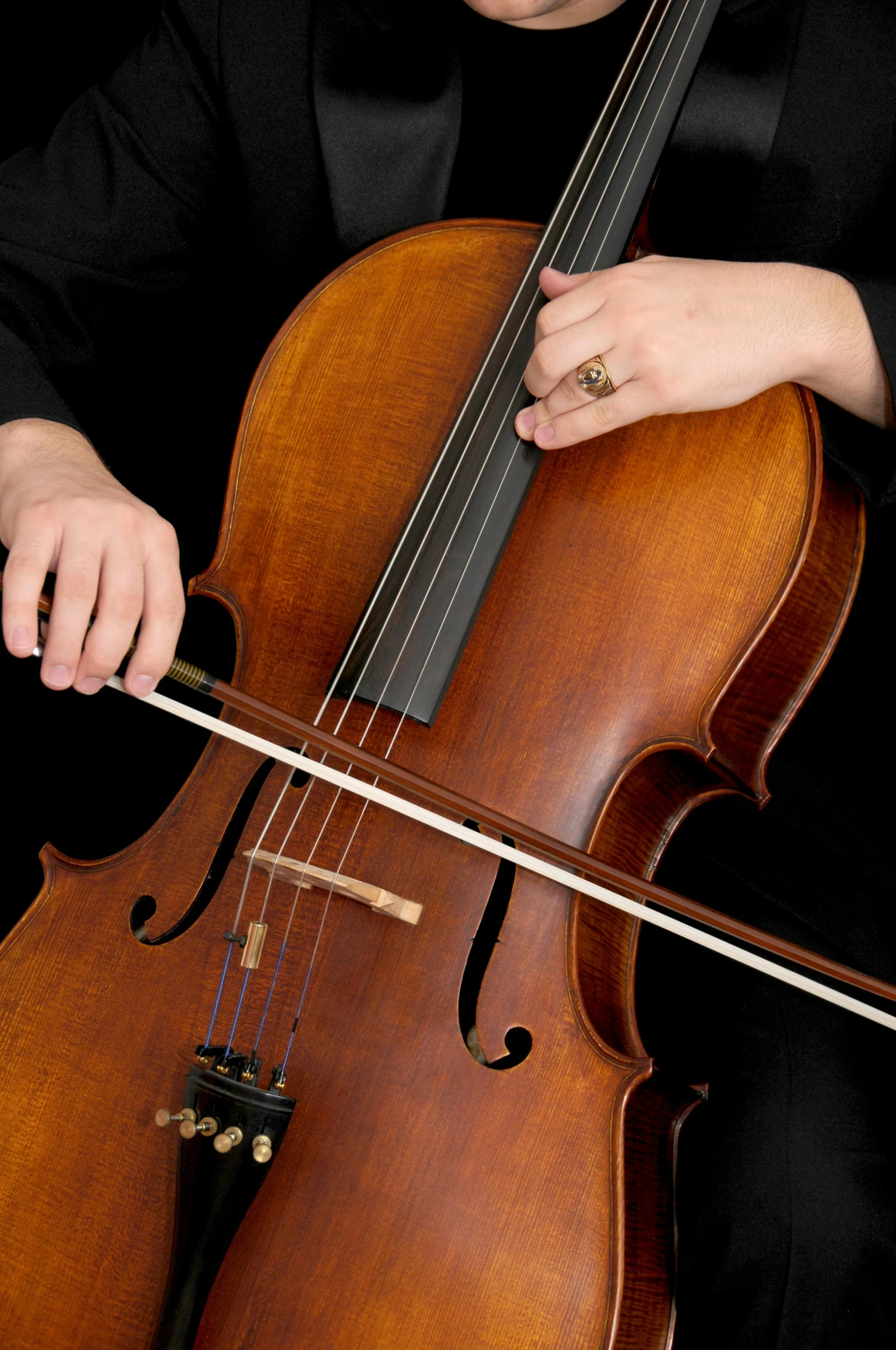 a woman playing a cello on a black background, by James Morris, closeup of arms, plain background, 15081959 21121991 01012000 4k, strathmore 2 0 0