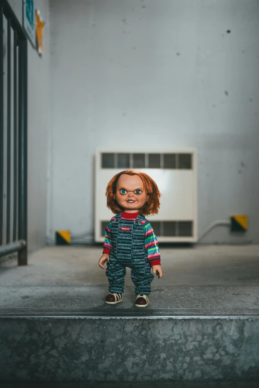 a doll that is standing on some steps, a cartoon, pexels contest winner, lowbrow, chucky, angry looking at camera, indoor picture, stranger things character