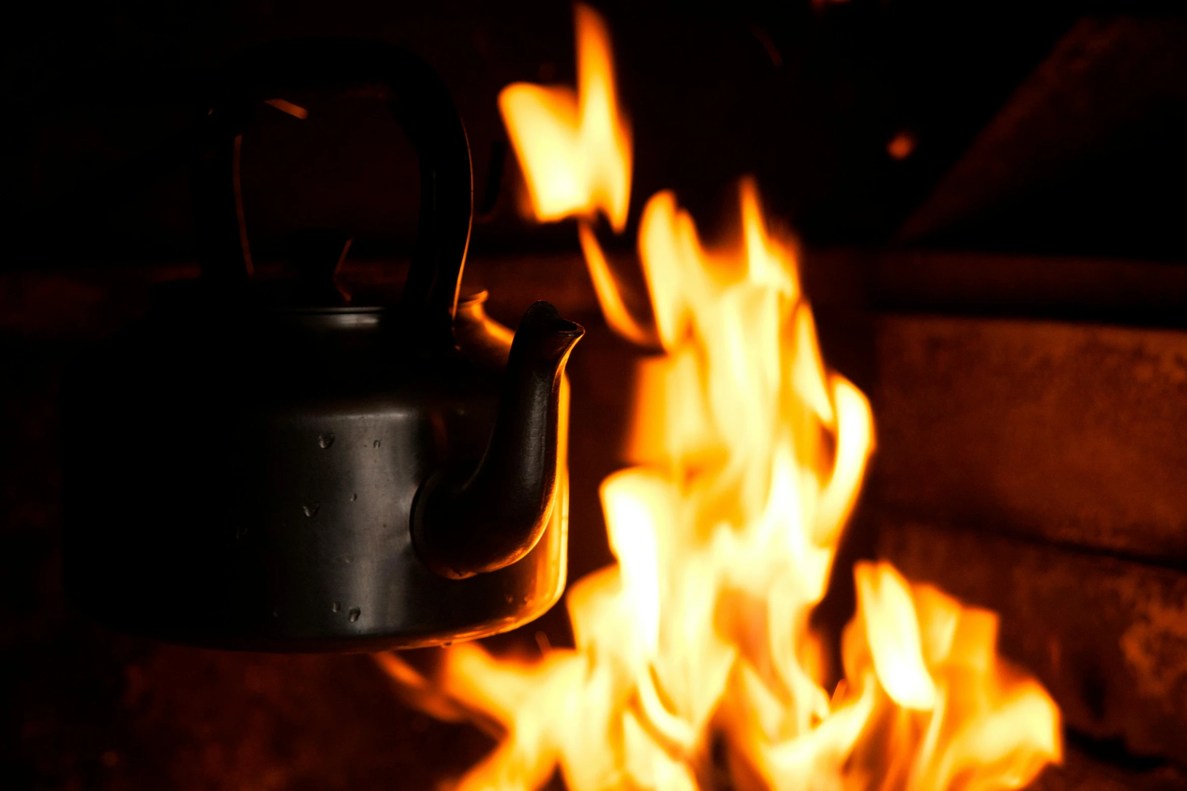 a kettle that is sitting in front of a fire, profile image, thumbnail, flame everywhere, up close picture