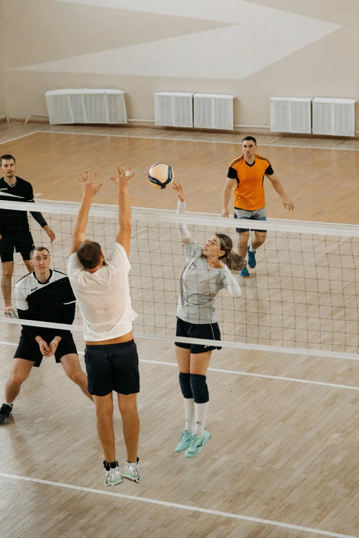 a group of people playing a game of volleyball, pexels contest winner, arabesque, tall ceilings, in russia, athletic footage, thumbnail