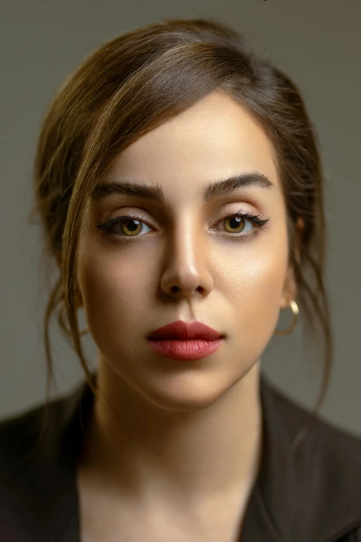 a woman in a black jacket posing for a picture, by irakli nadar, trending on pexels, hyperrealism, large eyebrows, middle eastern, portrait. 8 k high definition, soft oval face