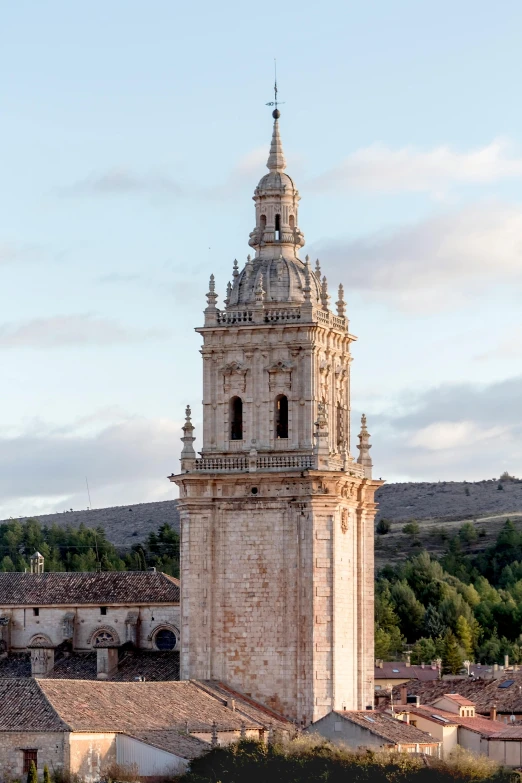 a tall tower with a clock on top of it, inspired by Luis Paret y Alcazar, baroque, wide aerial shot, domes, quechua, towering high up over your view