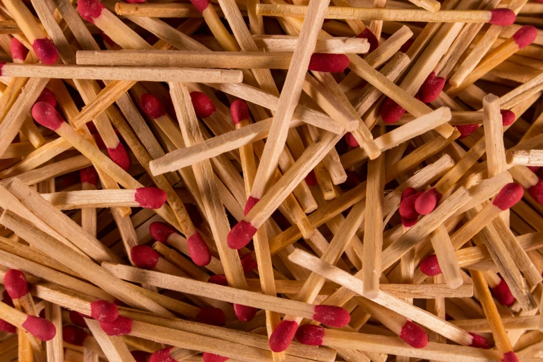 a pile of matches sitting on top of each other, profile image, zoomed in, product shot, small fire