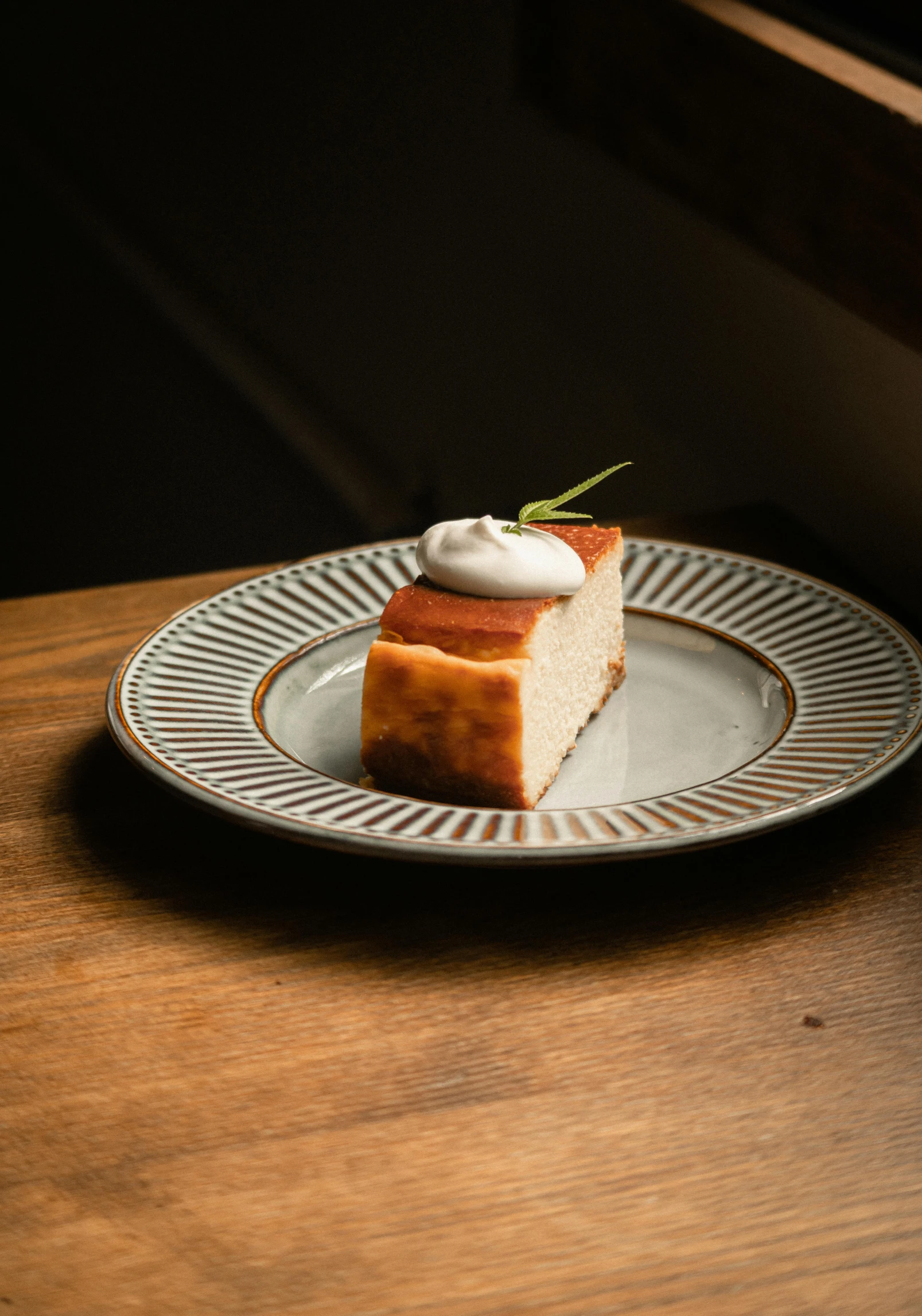 a piece of cake on a plate on a table, inspired by Barthélemy Menn, renaissance, sycamore, white rabbit, 4l, bakery