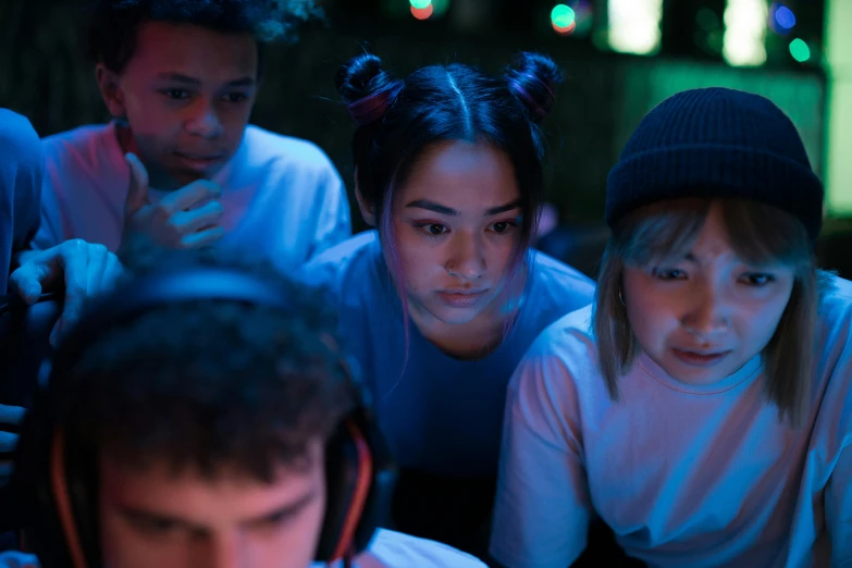 a group of people looking at a computer screen, an album cover, inspired by Liam Wong, trending on pexels, intense expression, wearing a gaming headset, high angle close up shot, charli bowater and artgeem