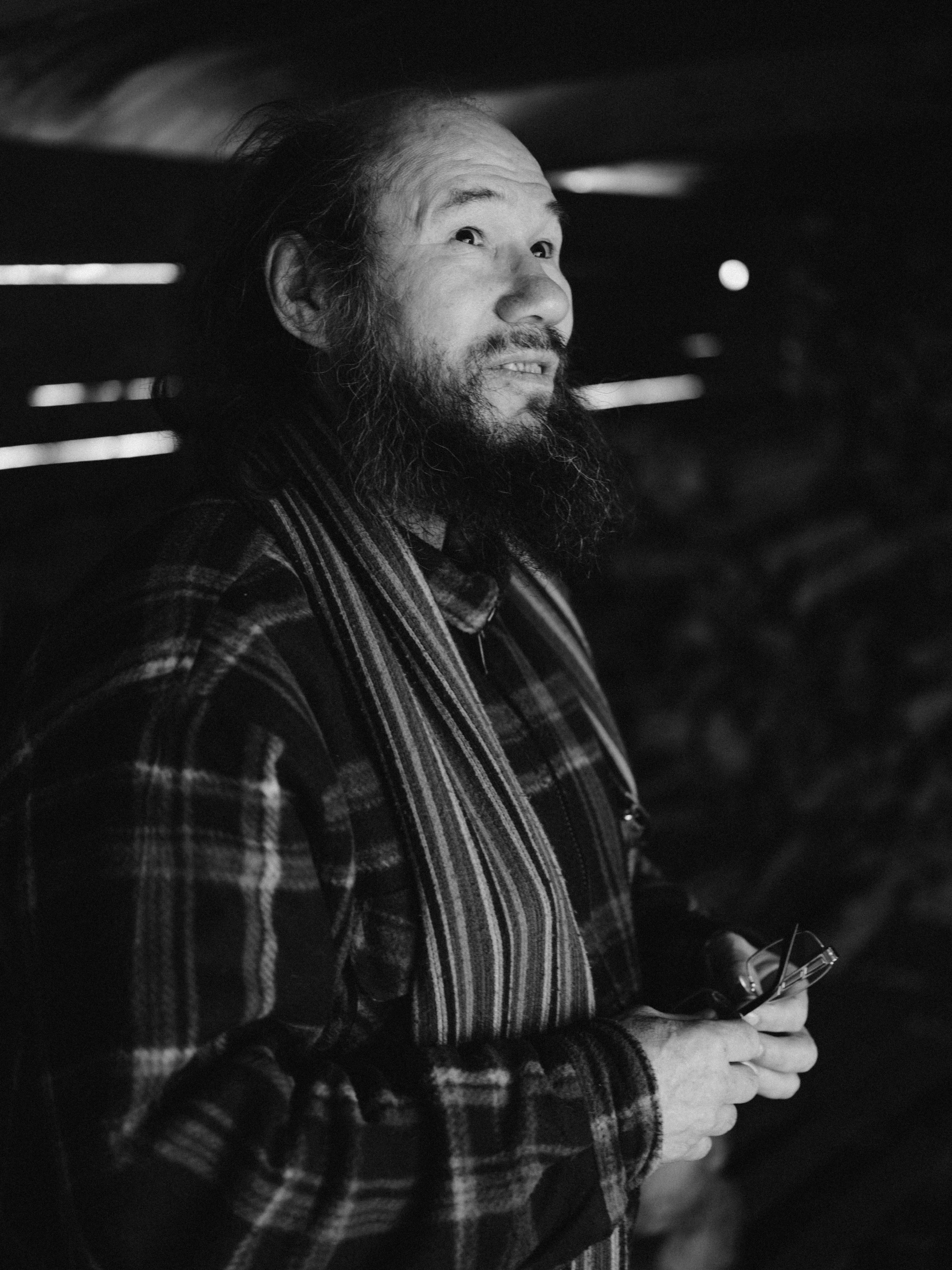 a black and white photo of a man with a beard, a black and white photo, unsplash, shin hanga, taken in the 2000s, lit from the side, lumberjack, dressed with long fluent clothes