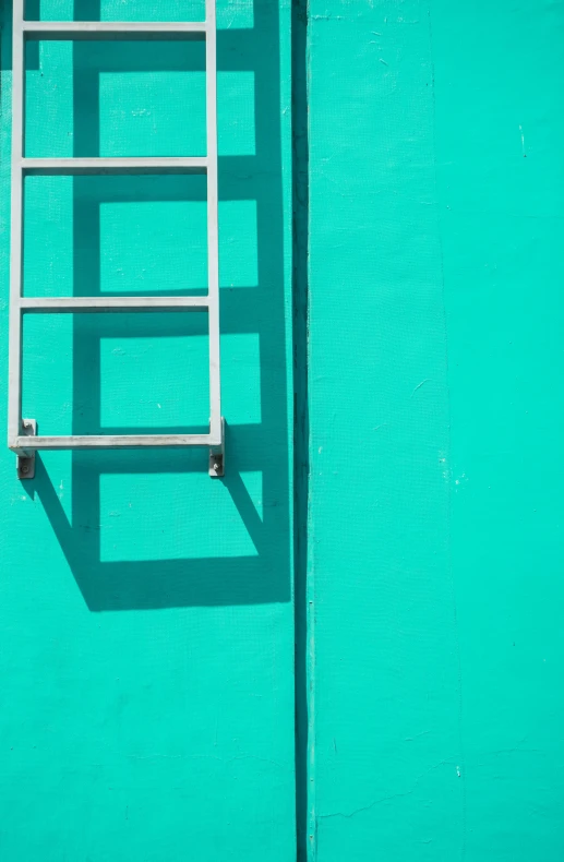 a ladder leaning against a green wall, a minimalist painting, inspired by Alexander Rodchenko, pexels contest winner, gradient cyan, high angle, square lines, silver and cool colors