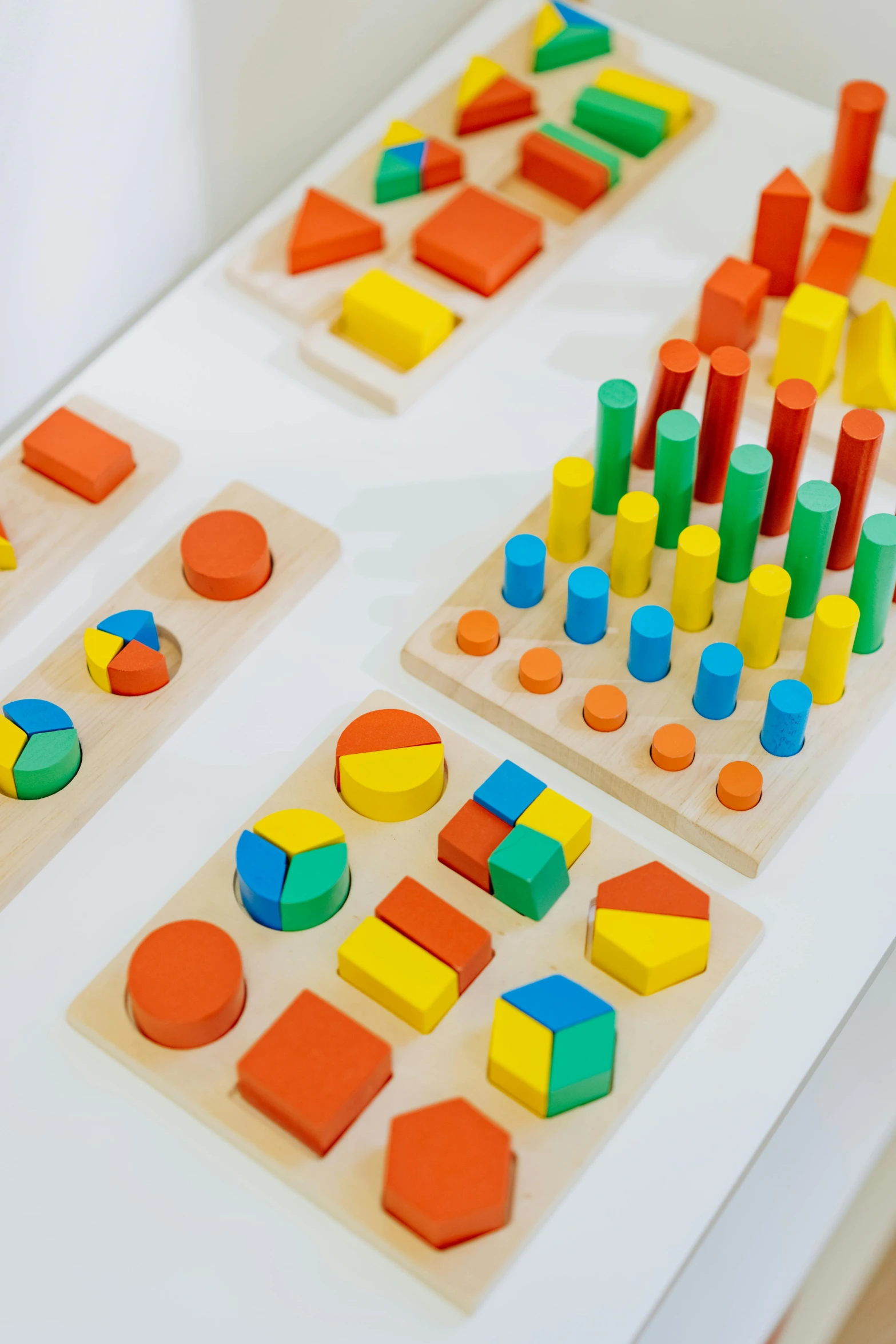 a table topped with wooden toys on top of a white table, unsplash, modular constructivism, mathematics and geometry, thumbnail, colorful signs, close up details