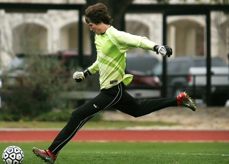 a person kicking a soccer ball on a field, trevor henderson, running, ap photo, kek