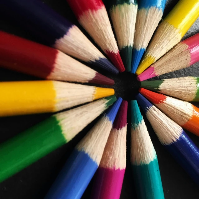 a group of colored pencils arranged in a circle, a picture, pexels contest winner, black and white coloring, two colors, tie-dye, wonderful details