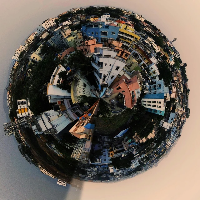 a panoramic view of a city from a bird's eye view, pexels contest winner, conceptual art, circular planet, sci - fi favela sculpture, taken on iphone 14 pro, stacked city